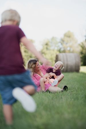 Playful outdoor scene in a summer field with motion and laughter.