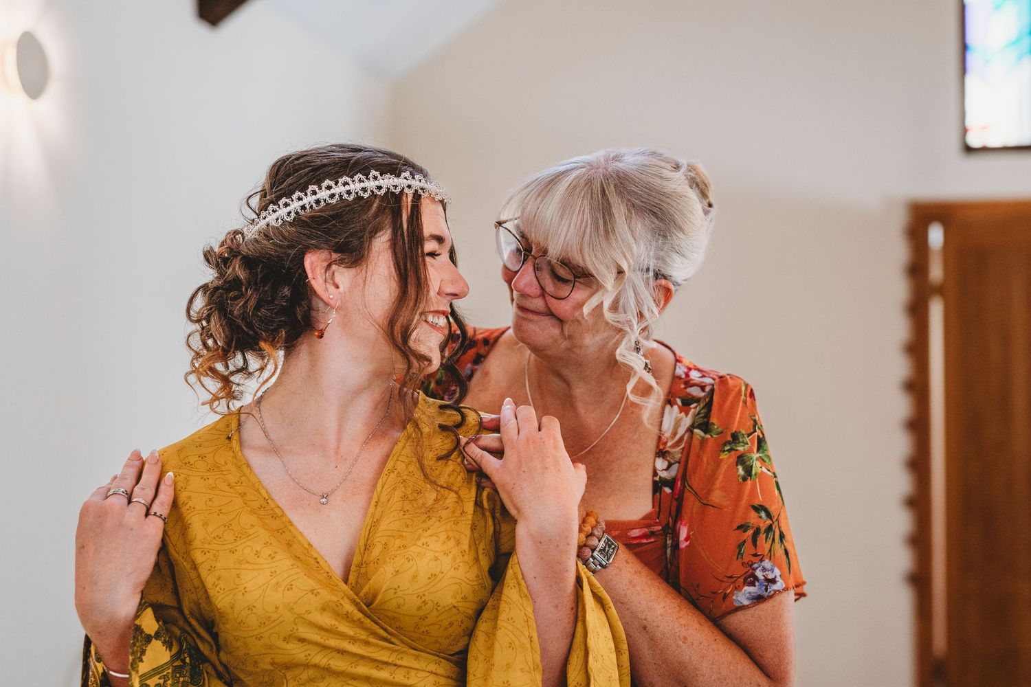 A couple in matching yellow outfits share intimate moments in a romantic photoshoot sequence.