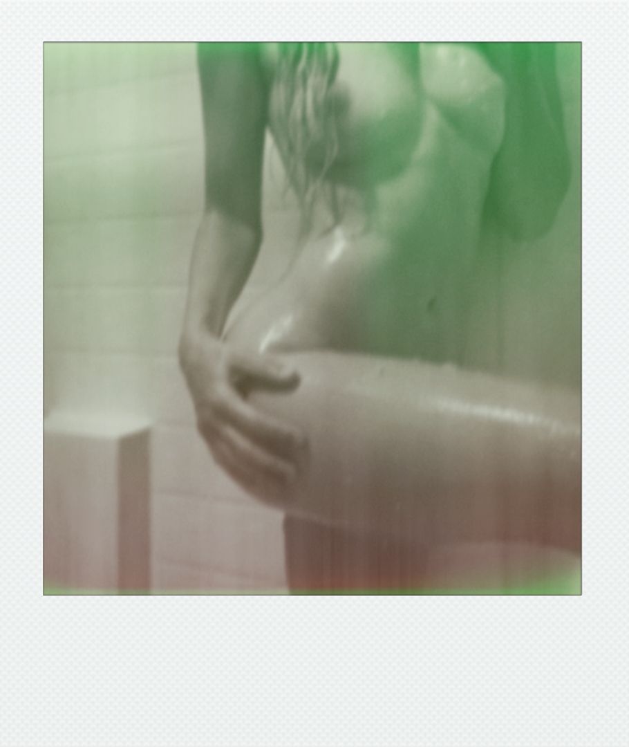 Artistic polaroid photograph with soft green tonal overlay and dreamy effect.