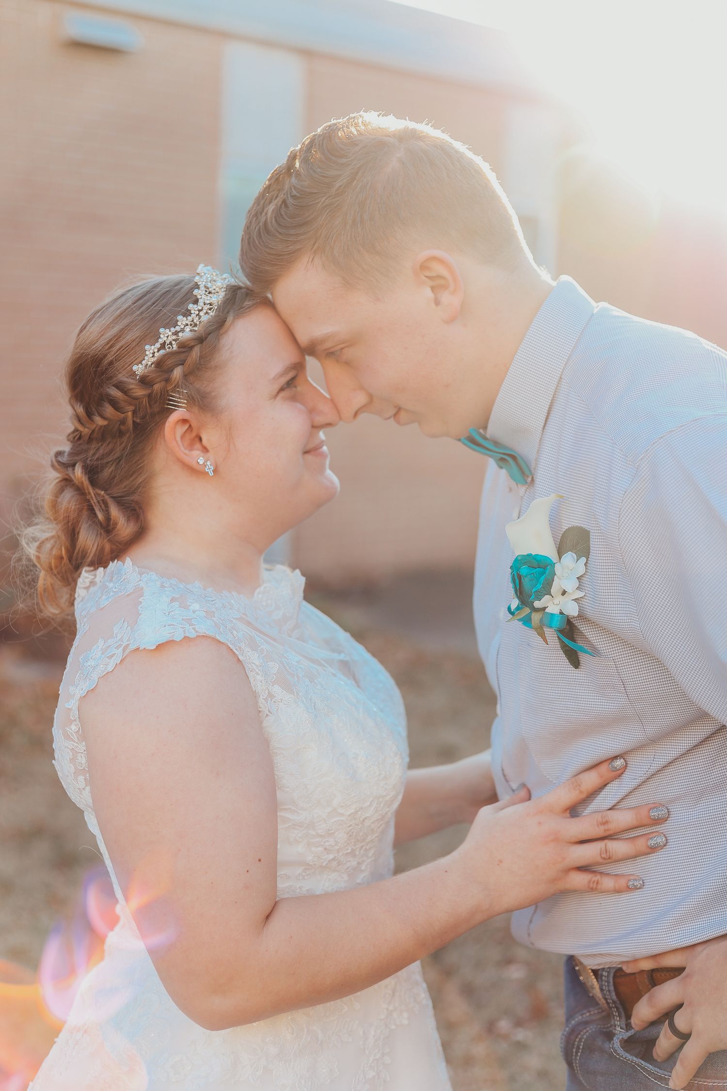 Romantic sunset wedding photos showing tender moments between newlyweds on their special day.