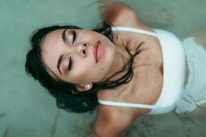 a woman lying in the sea in Mallorca
