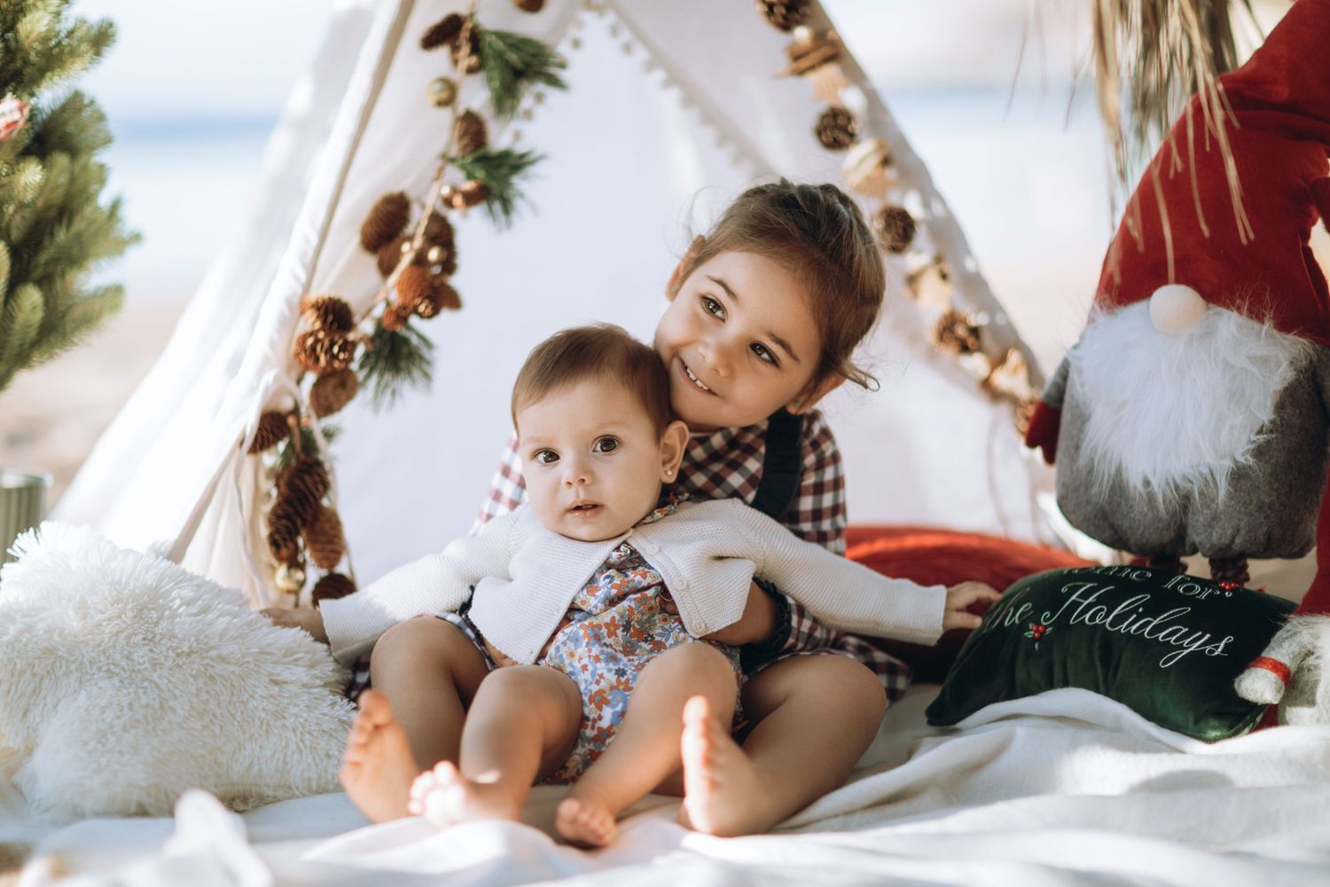 Little girls portrait with Christmas decorations in the background.