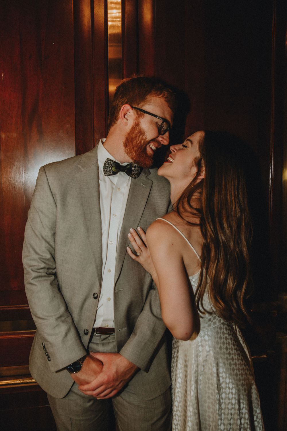 A couple gets cozy inside an elevator in Charleston