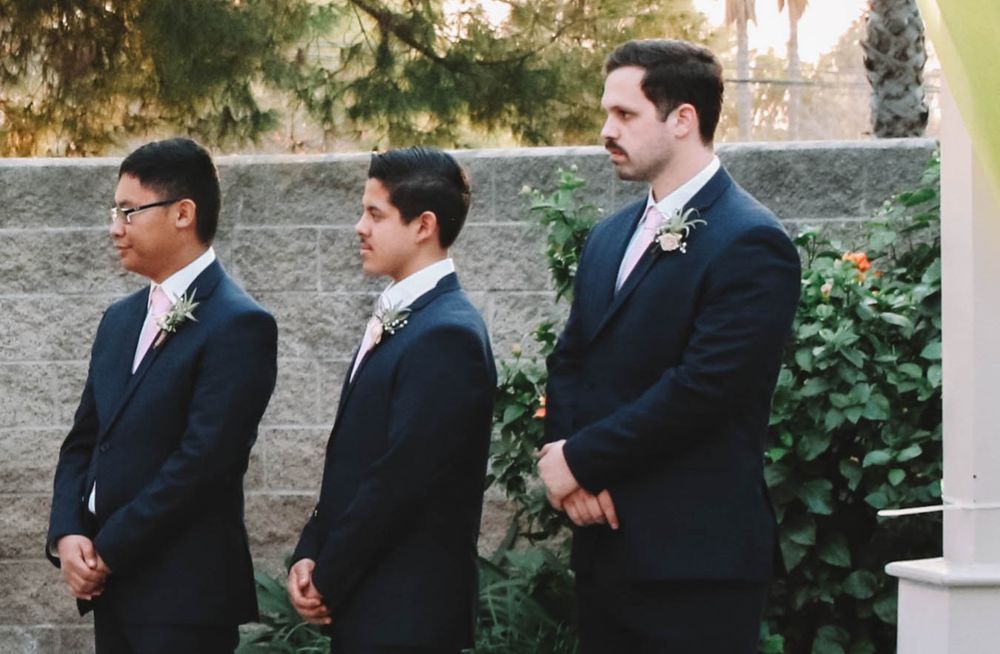 Boutonnieres were made with air plants that weren't pierced and that the groomsmen got to keep as mementos