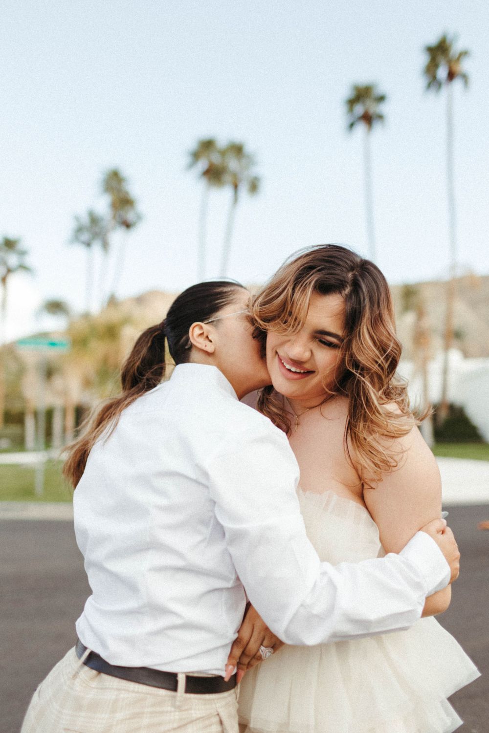 recently engaged beloveds, hug and giggle together