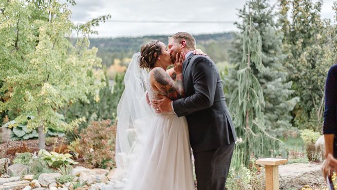 Wedding ceremony moments captured against scenic mountain backdrop.