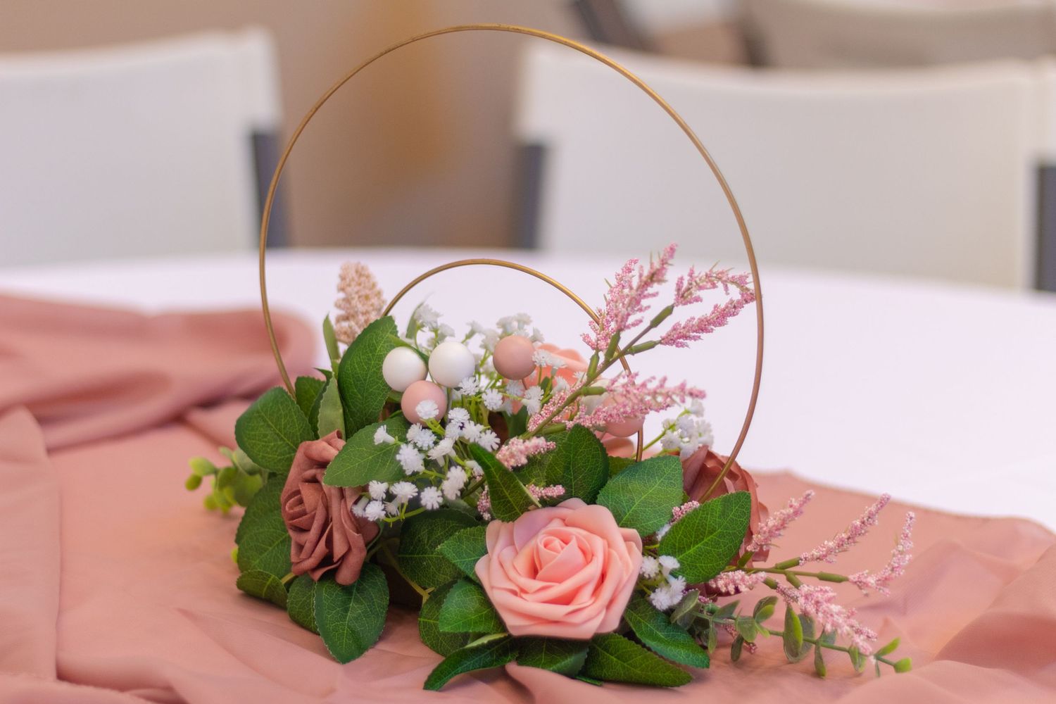 Center piece made of various pink colors on table