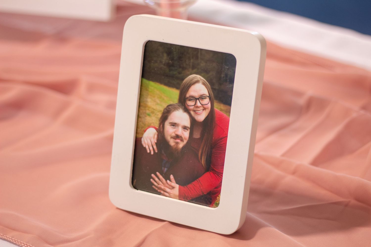 Photograph of soon to be husband & wife on table at wedding shower