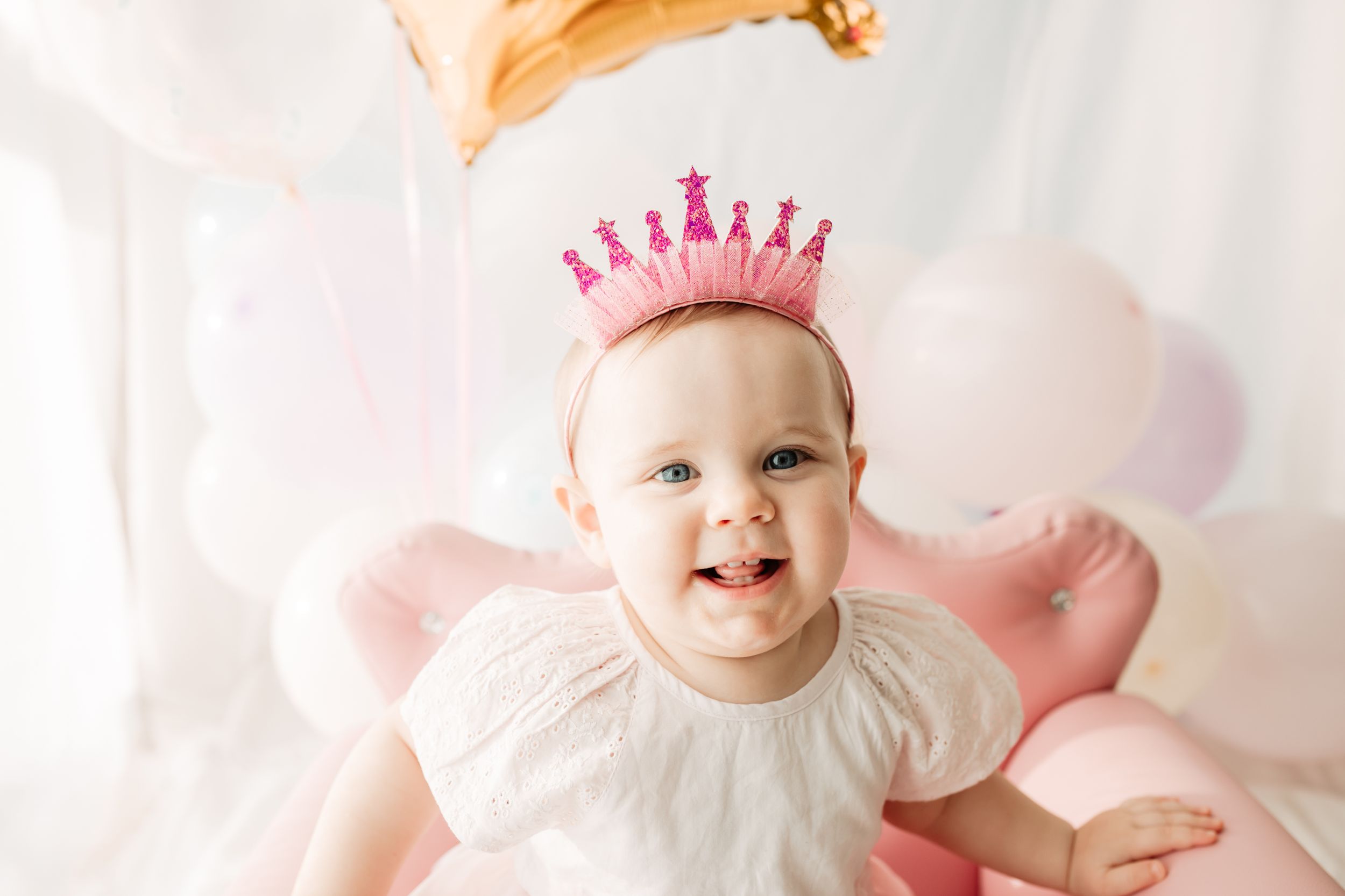 smiling baby girl at first birthday party