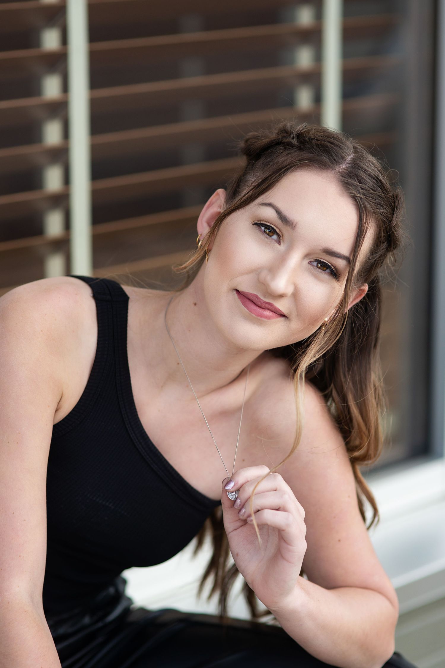 high school senior girl in modern outfit, urban setting