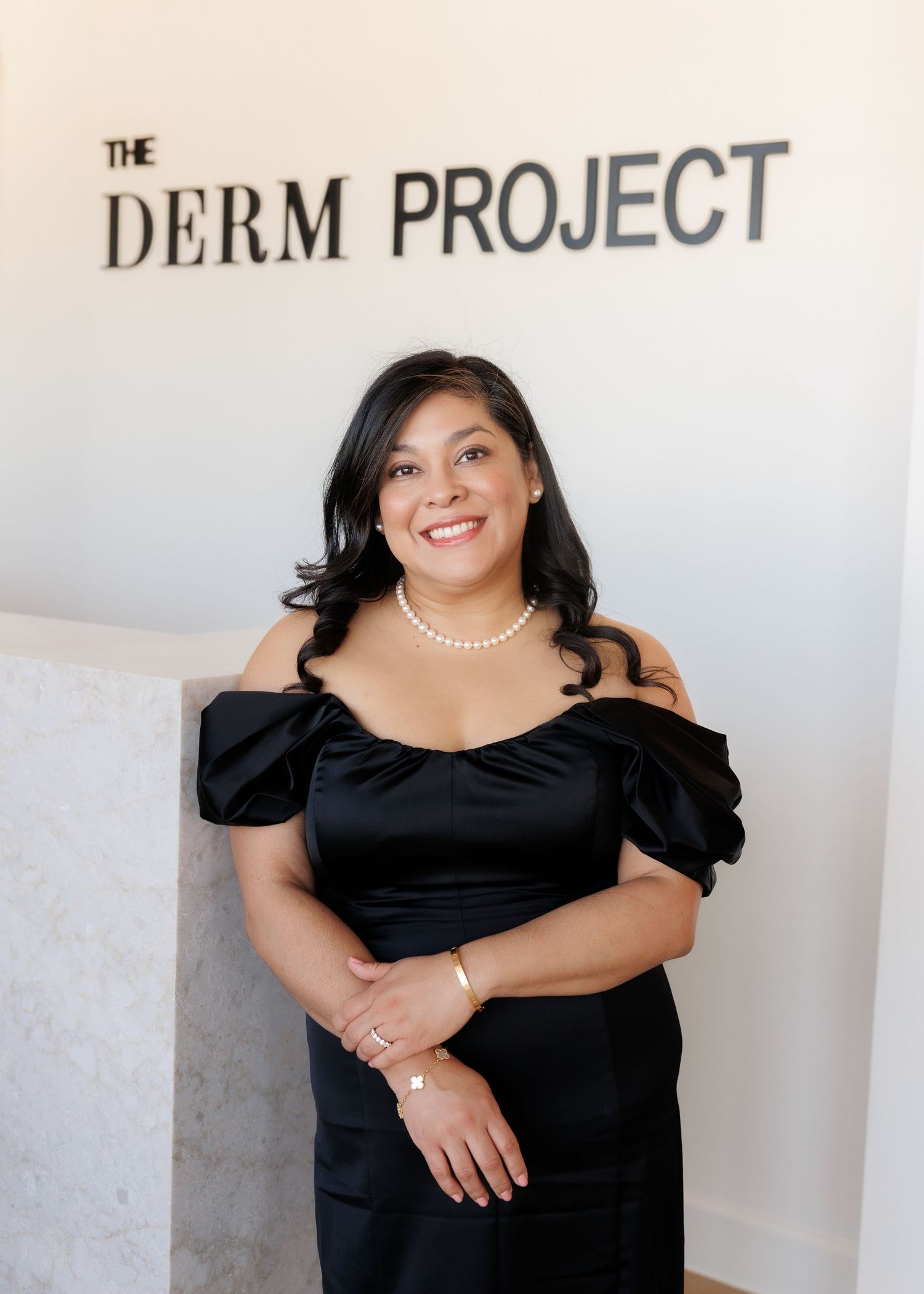 Houston brand photography by Gerry Myers Photo - business owner standing in front of business name Derm Project