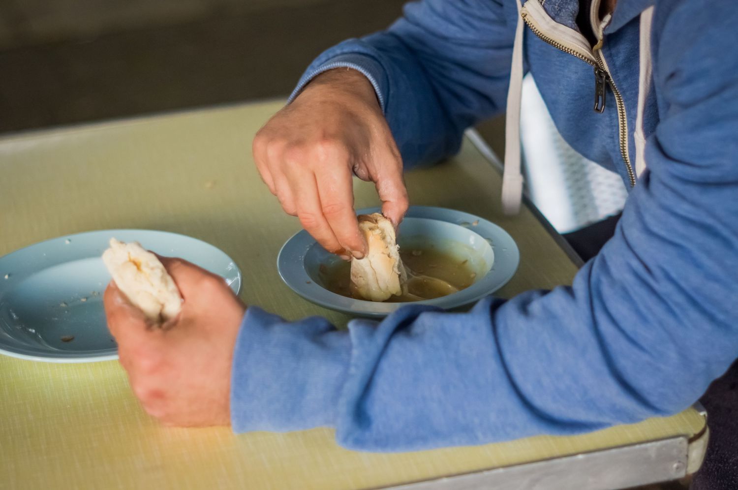 Close-up of a person shaping pottery by hand during a creative workshop in South Wales.