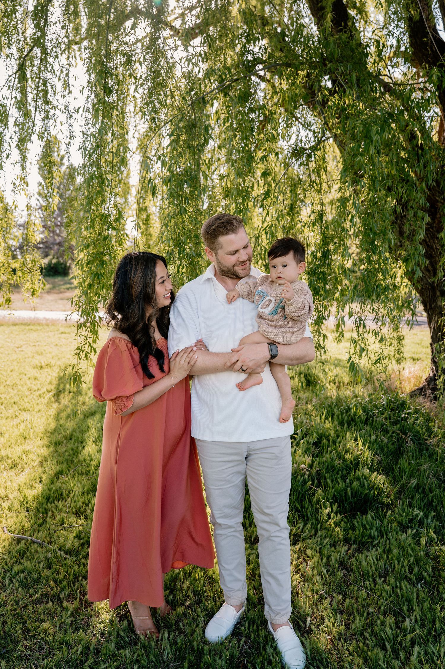 First birthday milestone photos with mom and dad at the park in Tri-Cities, WA