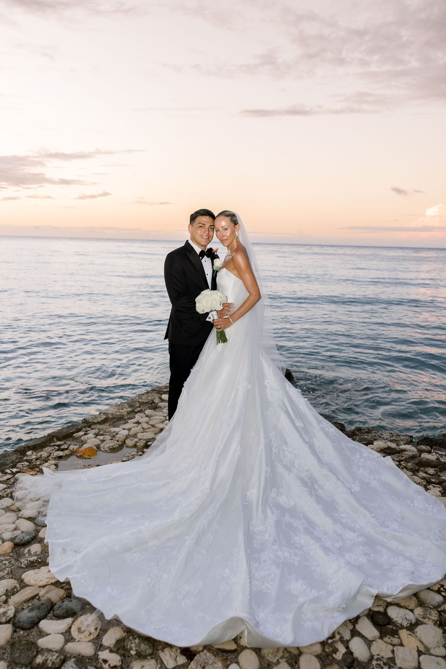 Bride and Groom by the beach for their wedding portraits at their Montego Bay Round Hill resort. Luxury destination wedding, Jamaica.