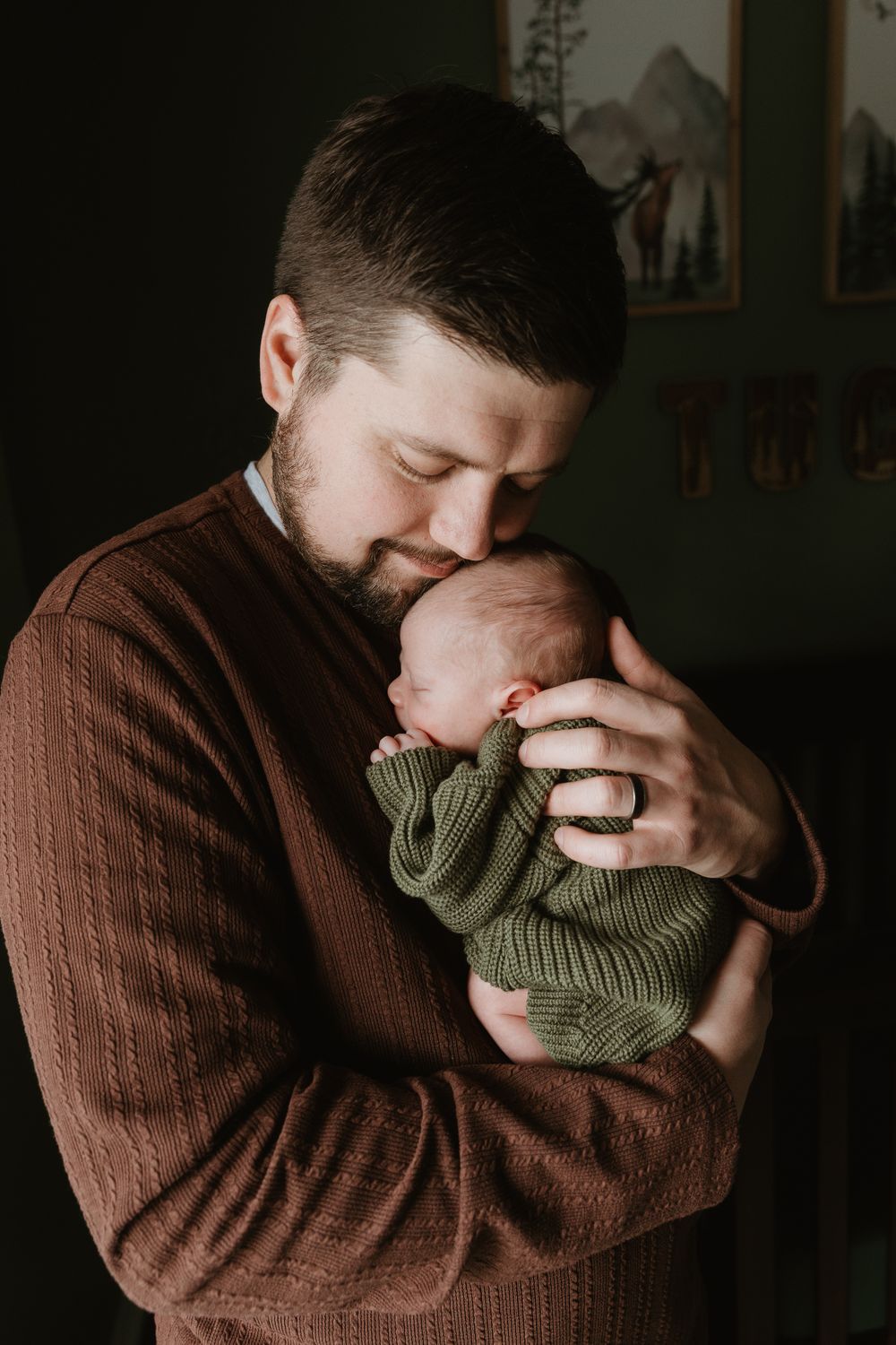 Precious Dad and baby image as dad holds newborn close in nursery during in-home newborn photography session East Tx Newborn Photographer