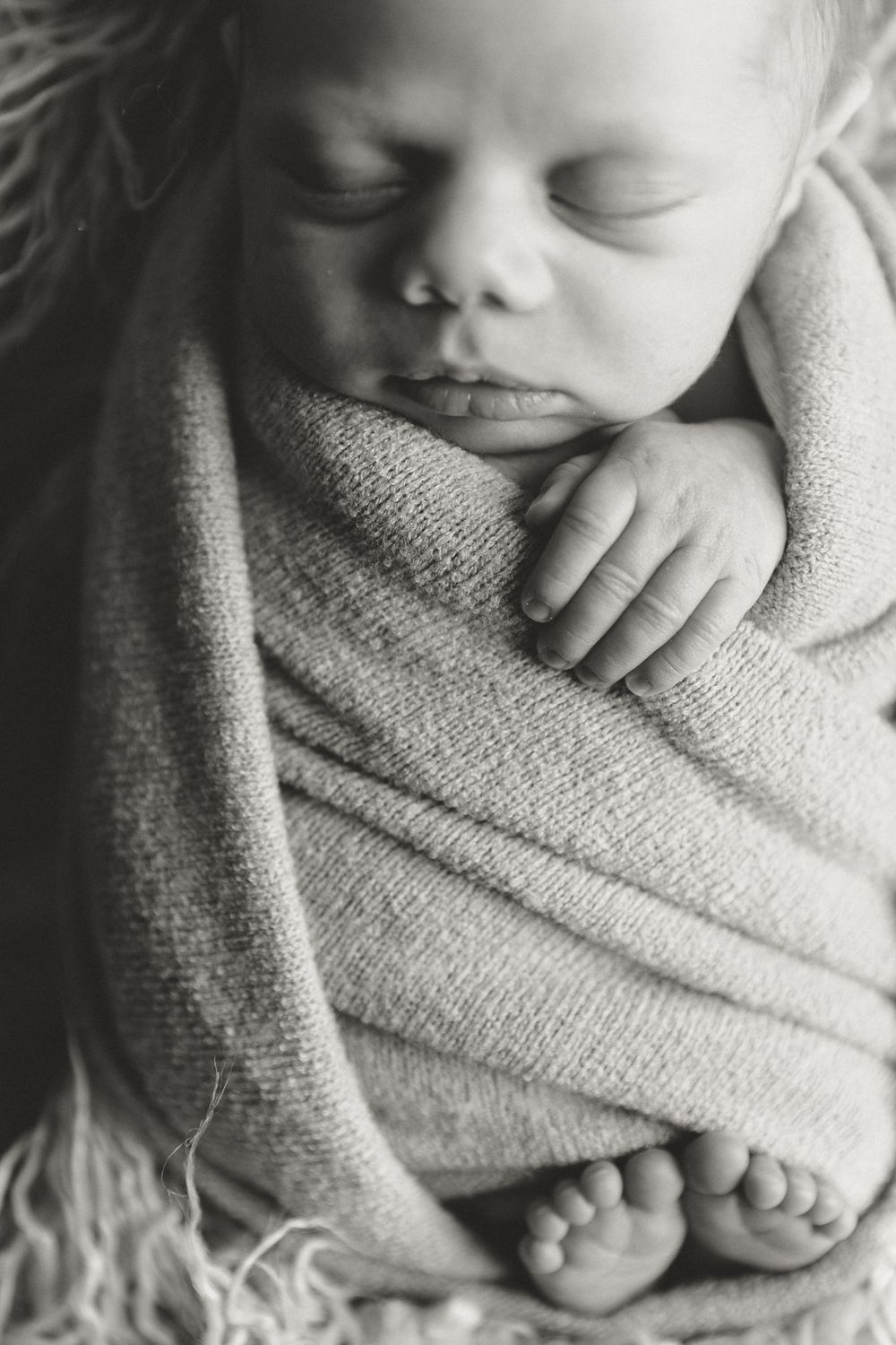 newborn solo image during newborn portrait in home lifestyle session with Tyler Tx newborn photographer