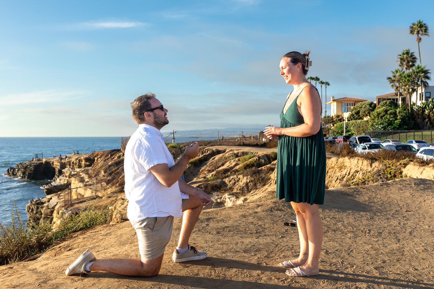proposal on the beach at sunset