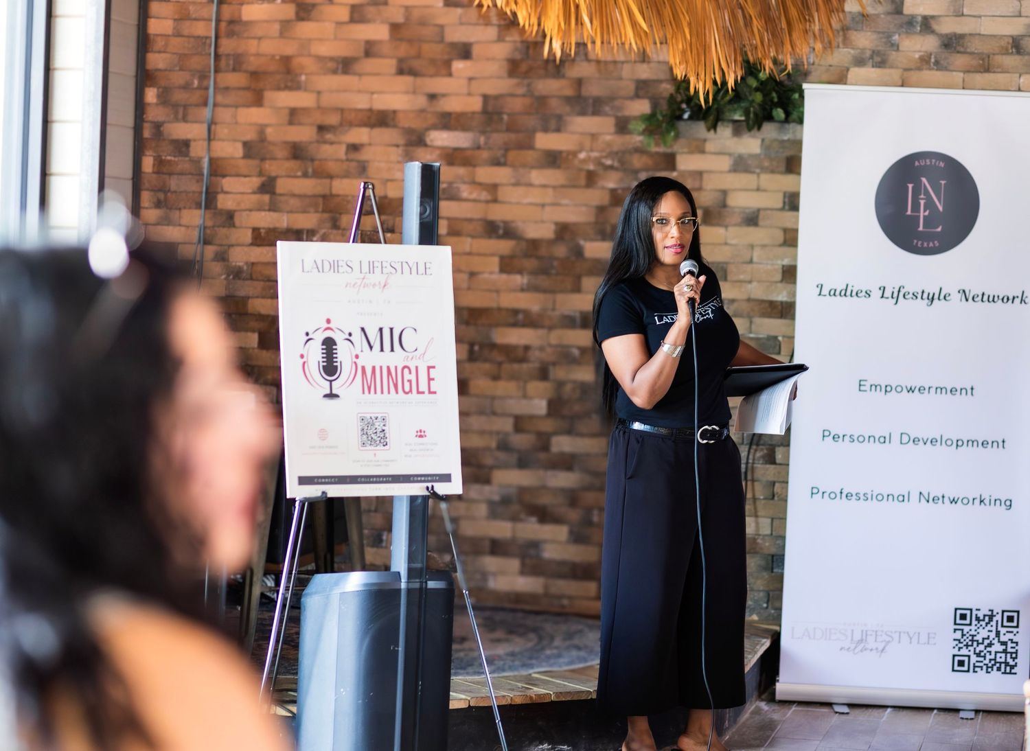 Woman speaking at Ladies Lifestyle Network Mic and Mingle event.