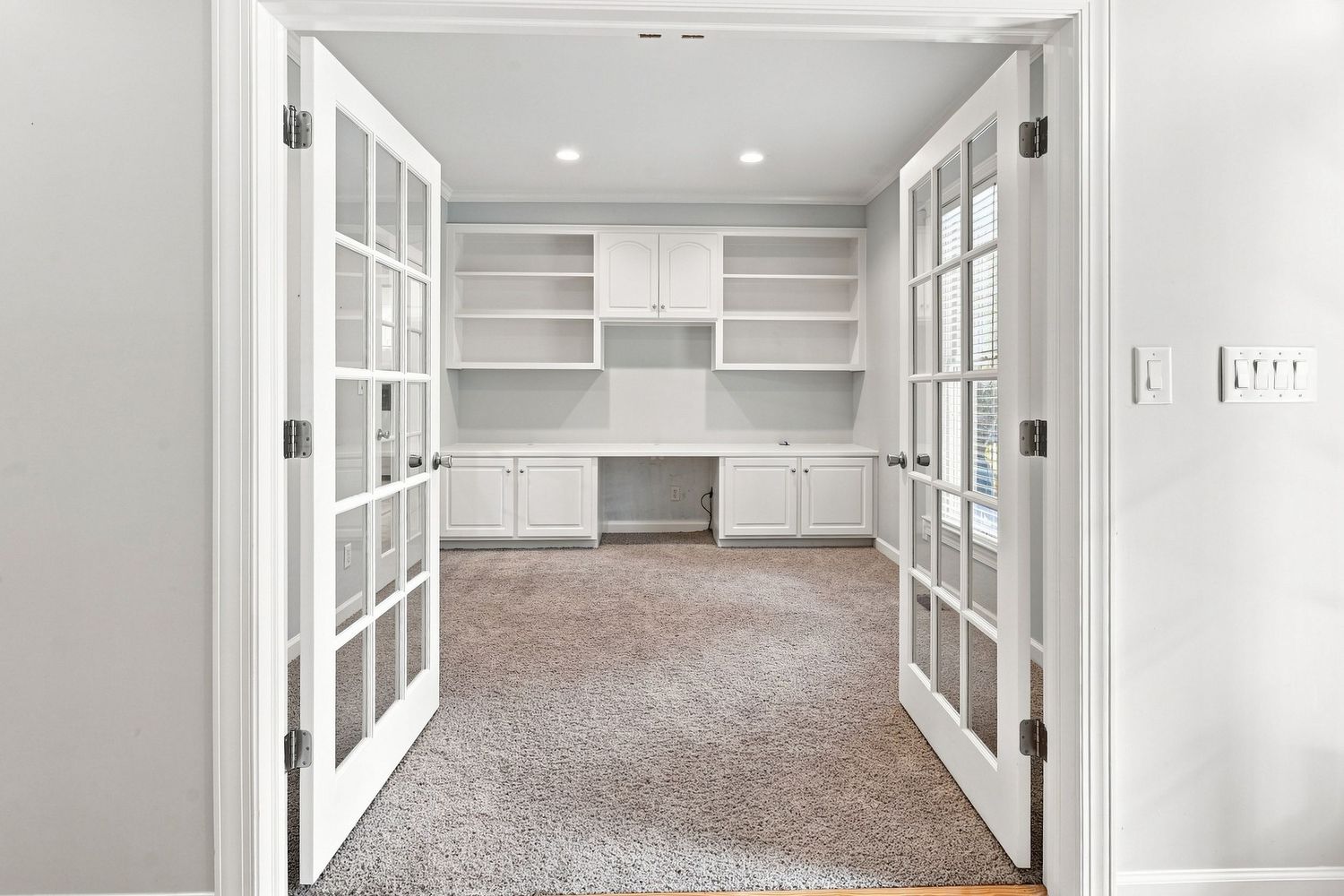 Formal professional office with elegant crown molding, shot with a professional wide-angle lens for the MLS.