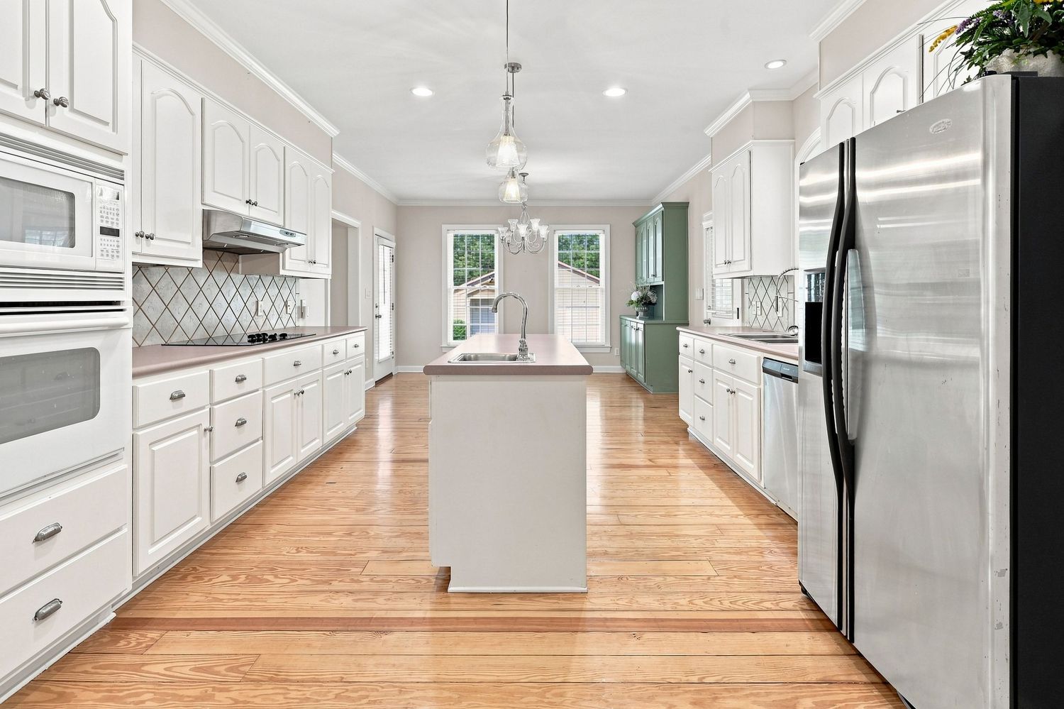 Modern kitchen with clean countertops and stainless steel appliances, photographed for a Bath, NC Real Estate Listing.