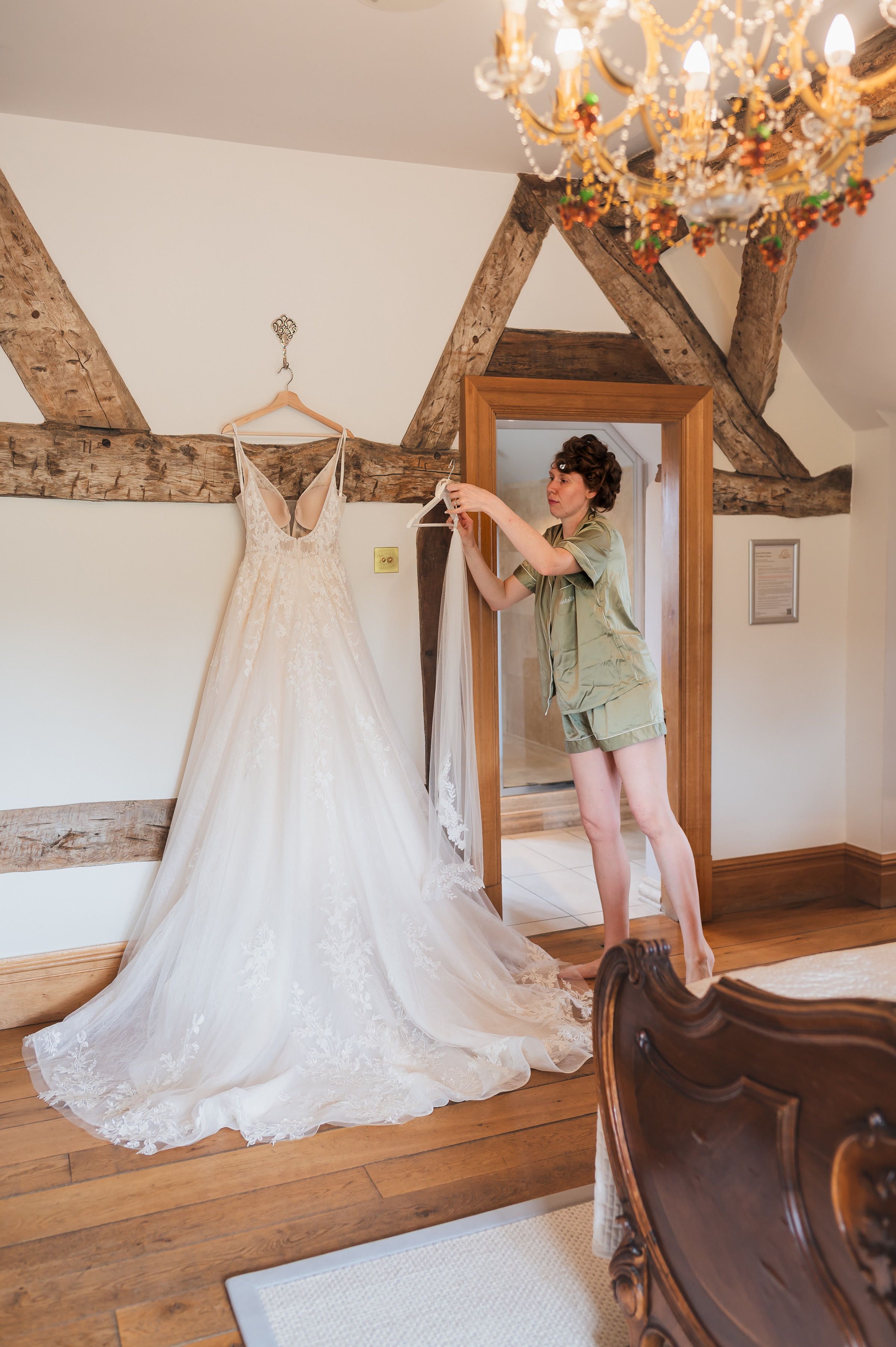 Charlotte's wedding dress hanging before the ceremony at Merrydale Manor