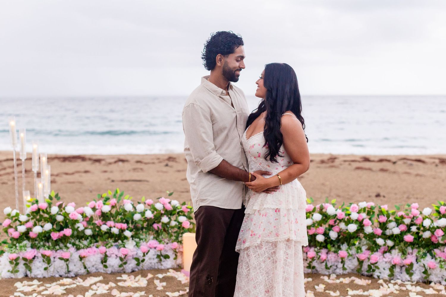 Marriage proposal on the beach with flowers and candles. Playa Guajataca, Isabela, Puerto Rico.
