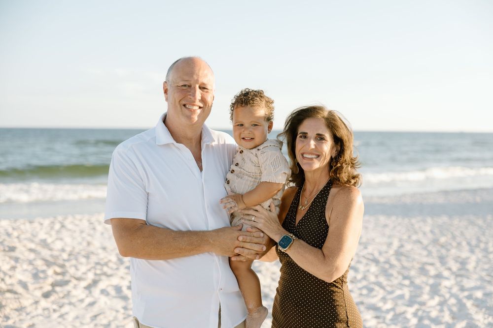 Grandson with grand mother and grand dad on the beach in Gulf Shores and Orange Beach Alabama.