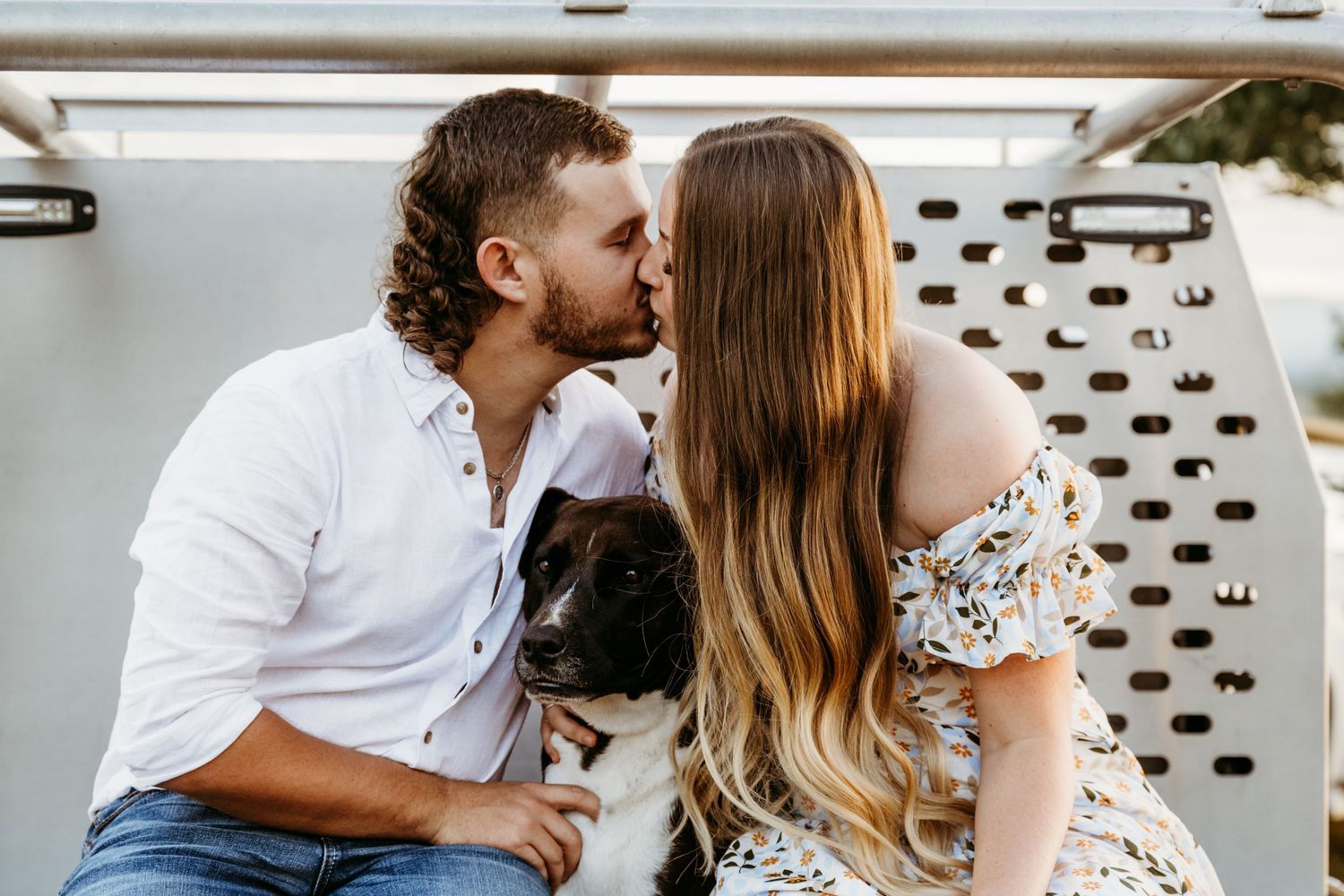 A tender moment shared on a boat deck during sunset.