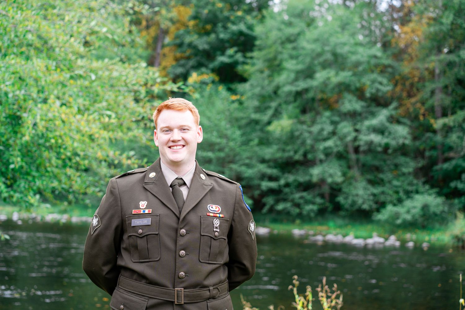 groom's portrait by the river