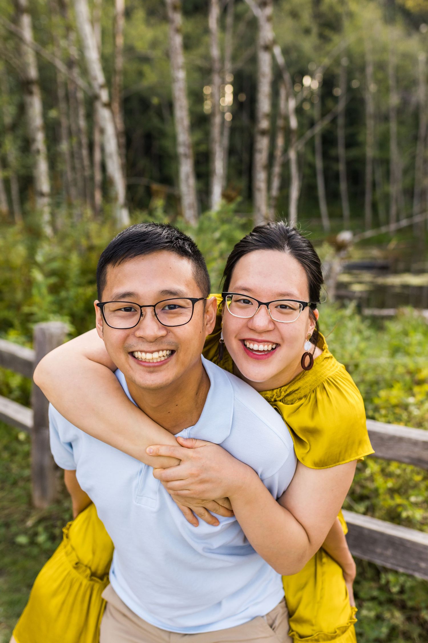 Wife piggybacking on husband at Green Timbers in Surrey BC
