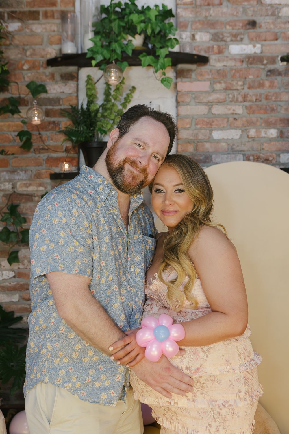 Beautiful portrait of the expecting couple at their Williamsburg baby shower, photographed by Paula Ortiz