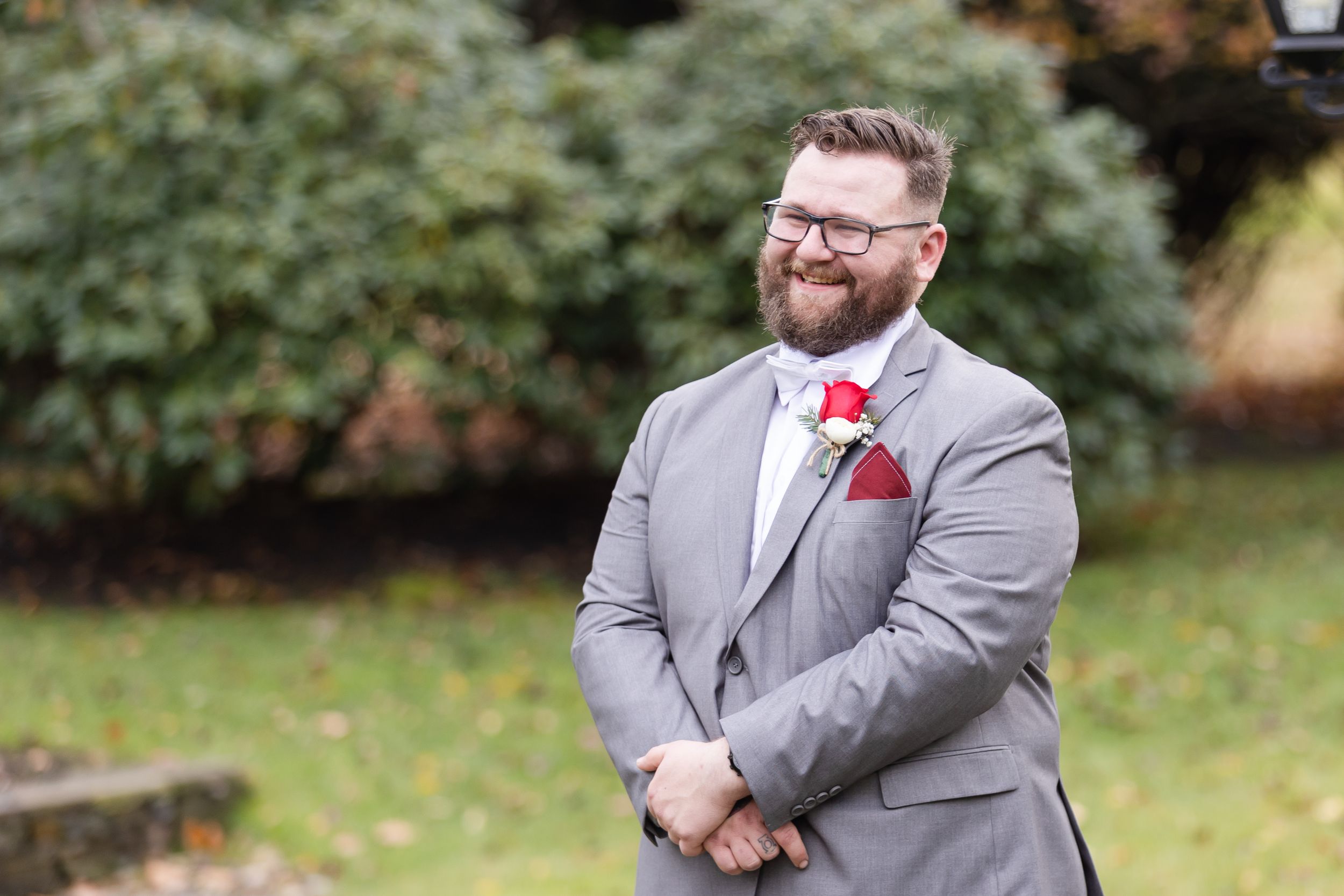 Groom smiling during first look - Lynn Monaco Photography