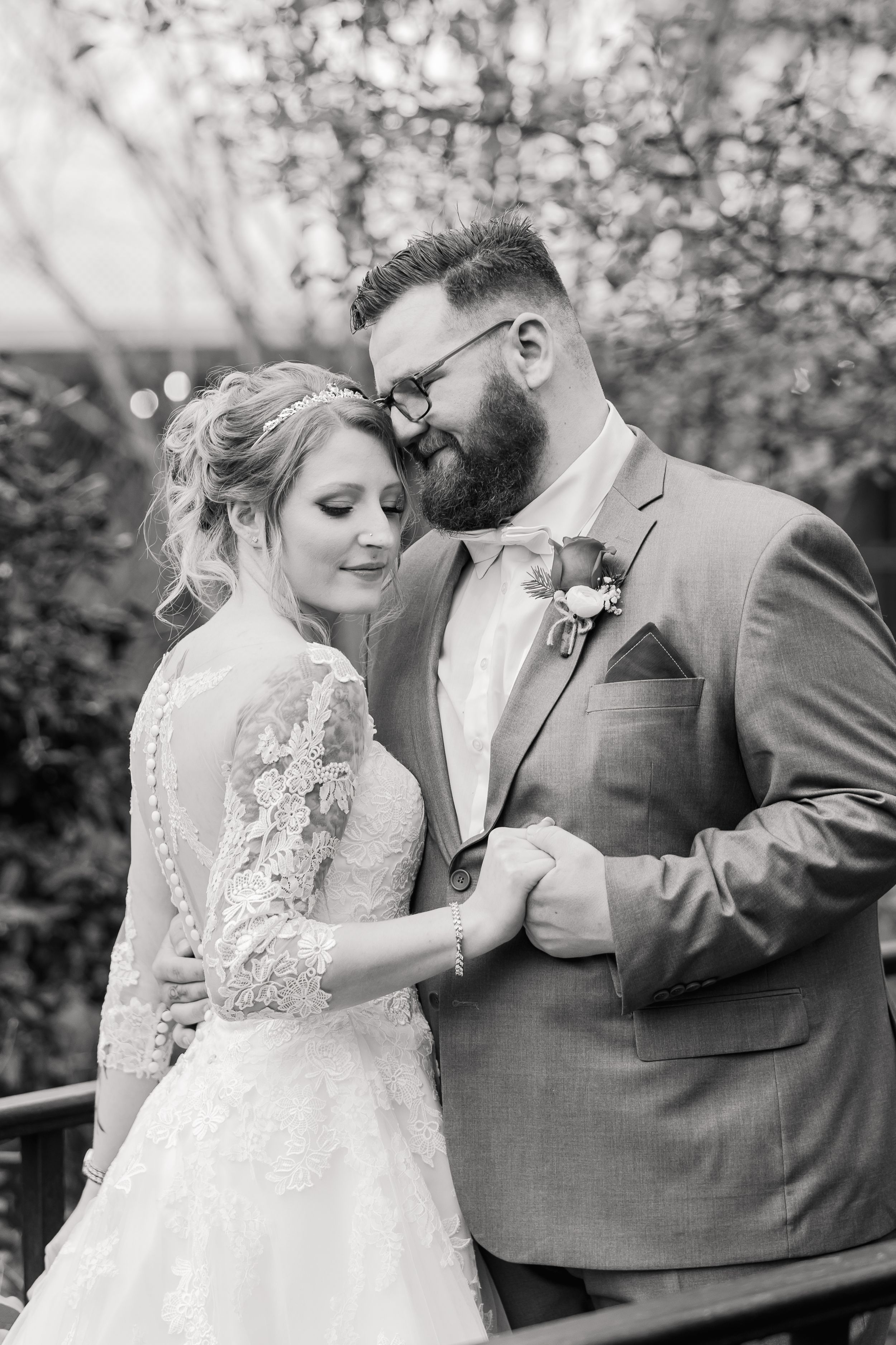 Bride and Groom cuddle after first look - black and white wedding photo - Lynn Monaco Photography