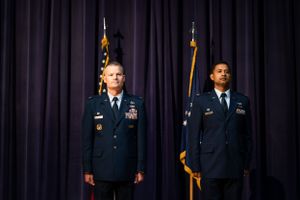 Two service members standing at attention during a formal military ceremony.