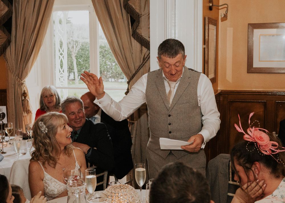groom addressing bride in his speech at a wedding at St Elizabeth's House in Plympton