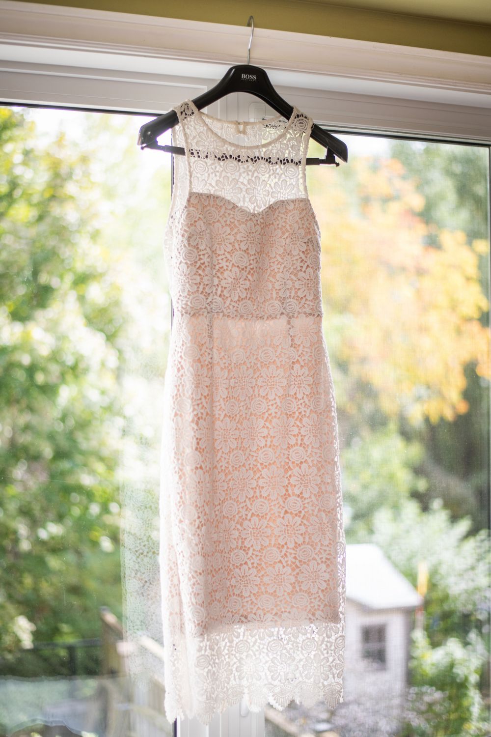hanging wedding dress before wedding ceremony