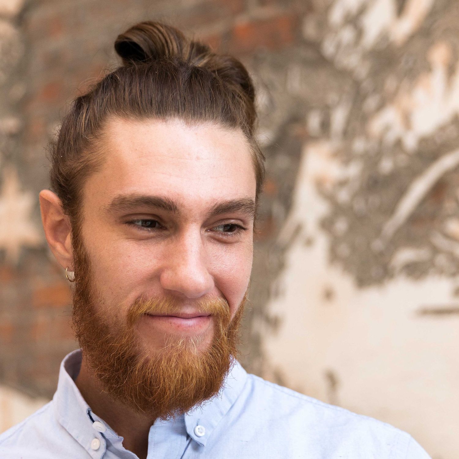 Headshot of a white male looking into the distance.