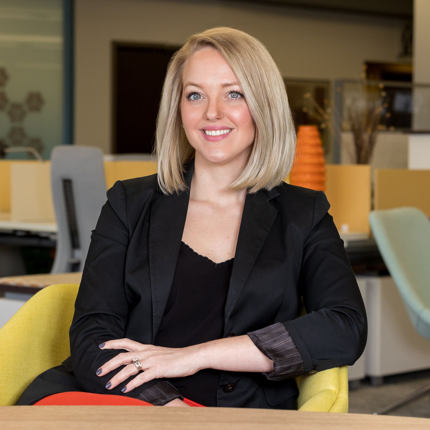Portrait of white woman smiling in an office setting