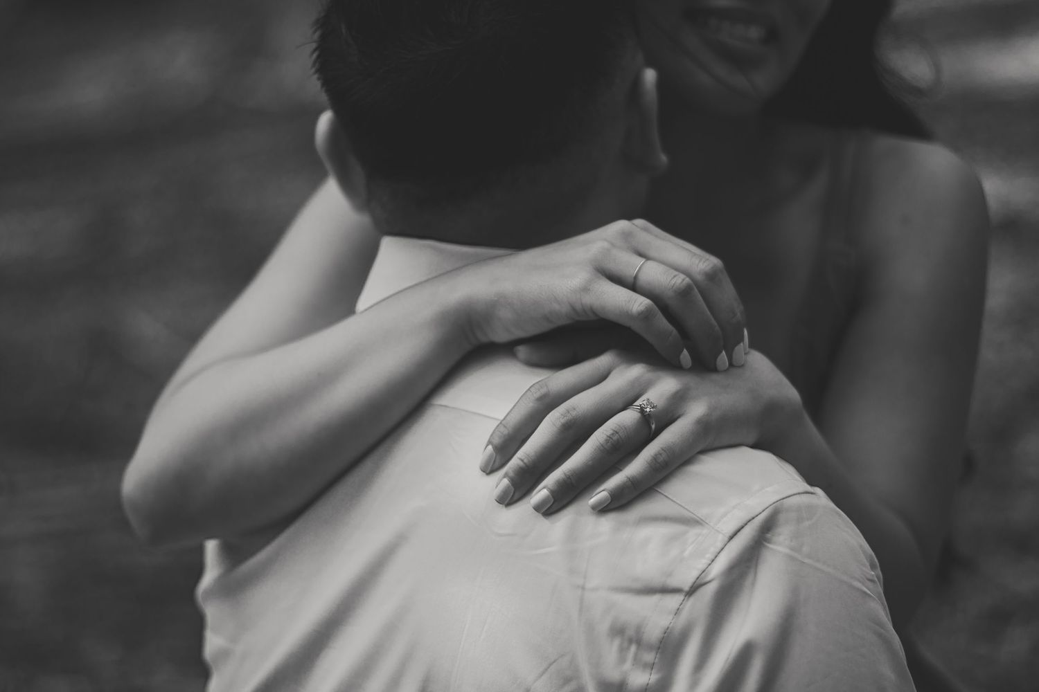 Black and white photo, capturing a couple in motion, reflecting candid connection.