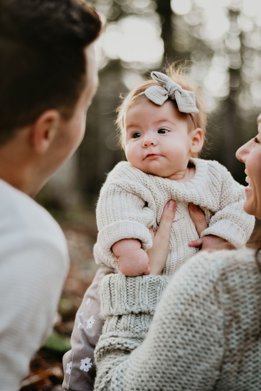 A sweet winter moment wearing a knit sweater and bow.