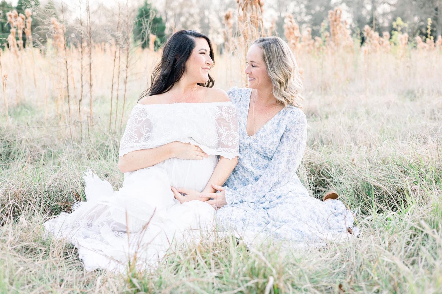 Two moms maternity session in tall grassy field in Augusta Georgia