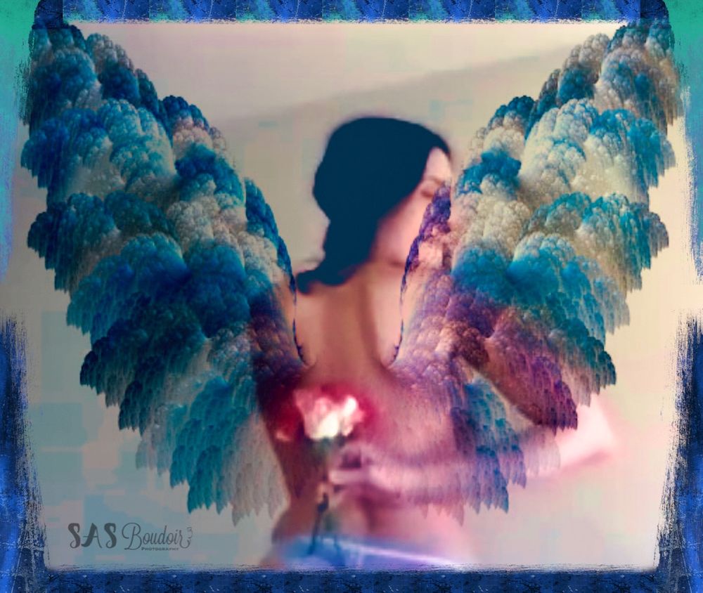 Artistic fantasy photo with ethereal blue and purple angel wings.