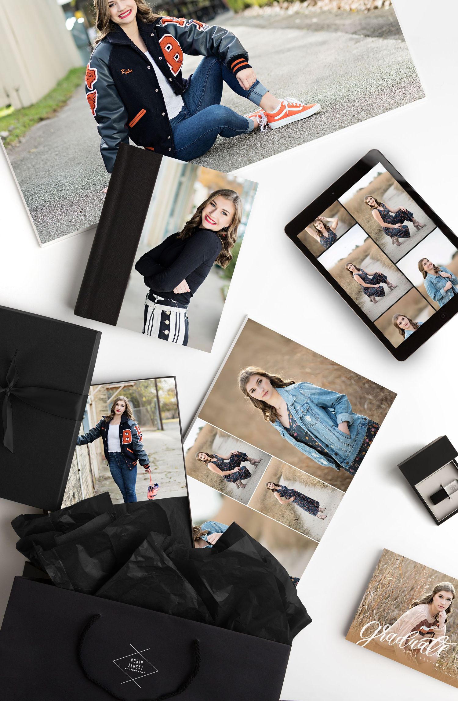 Flatlay of professional photography prints and products with a black presentation box.