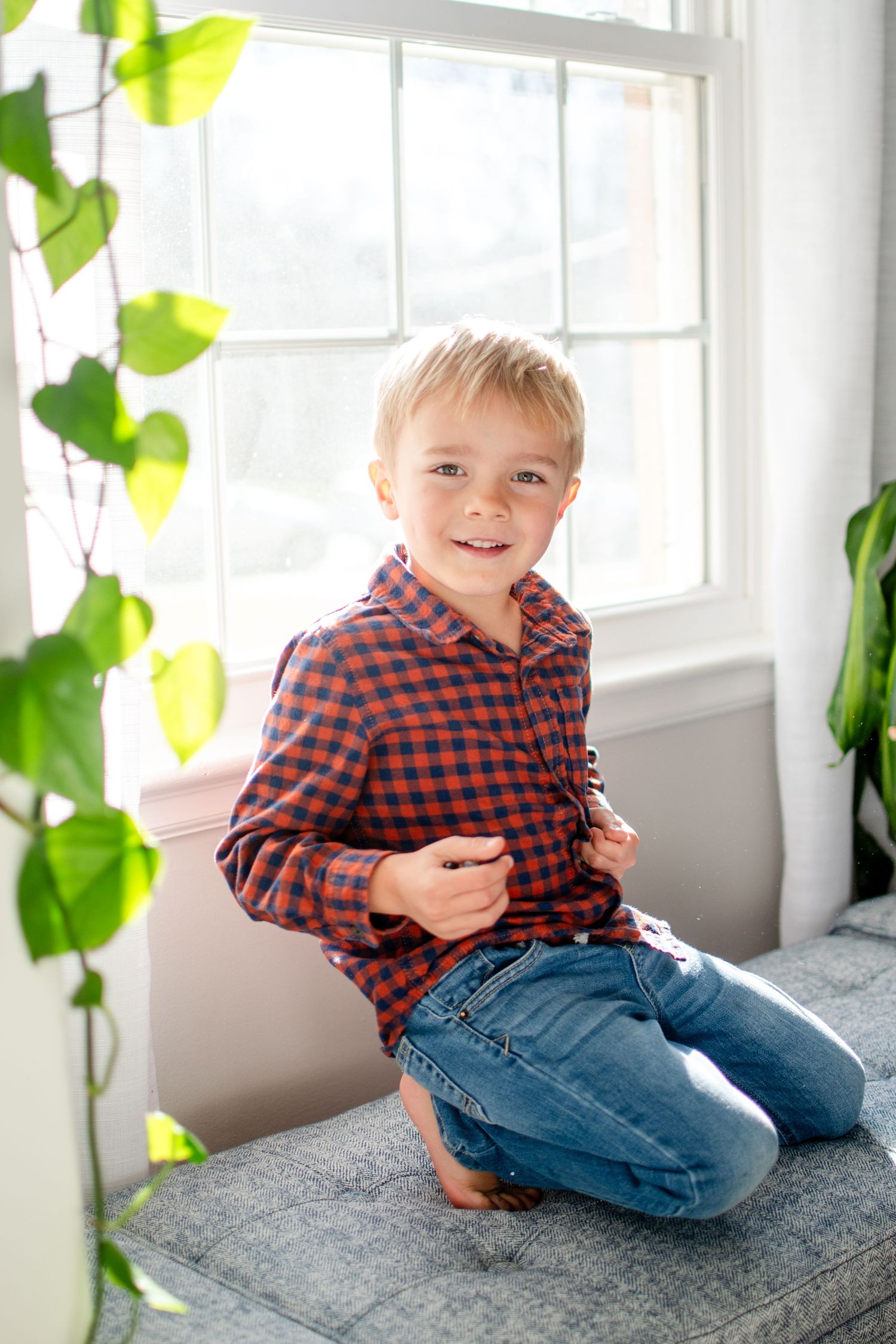 A elementary-aged child loves to watch garbage trucks through this window of their home.