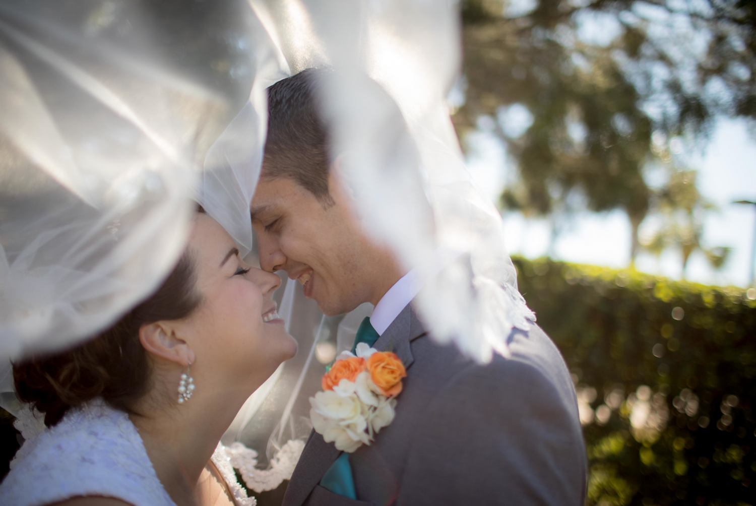 veiled bride and groom