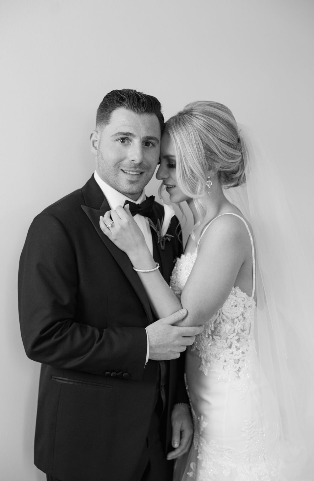 Intimate black and white portrait of newlyweds.