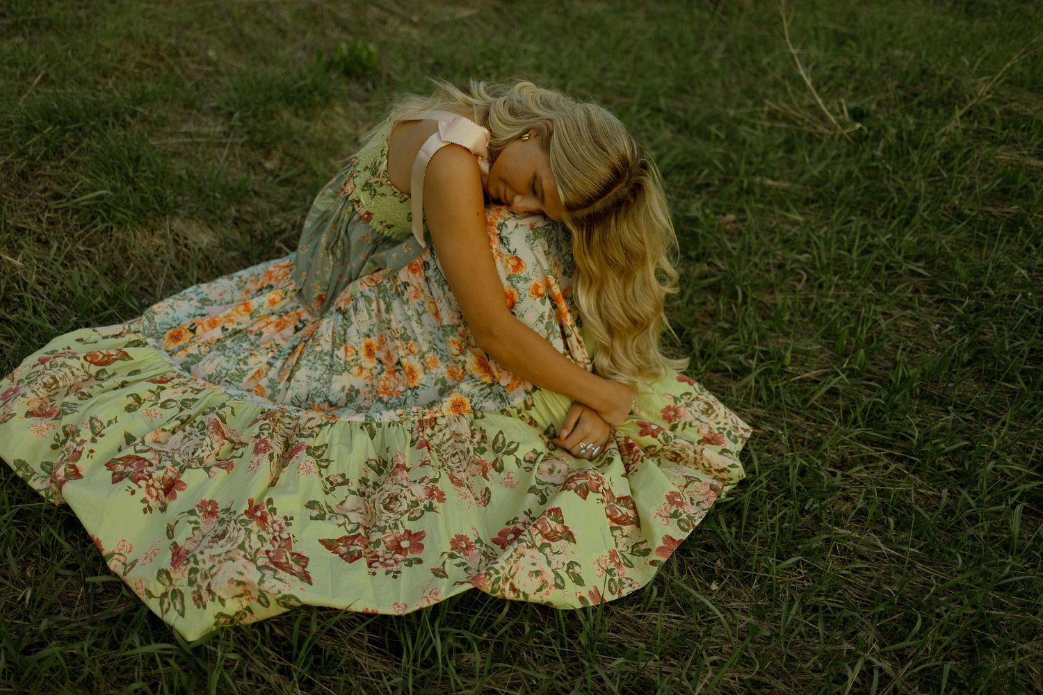 Girl in cottagecore magical dress snuggling herself