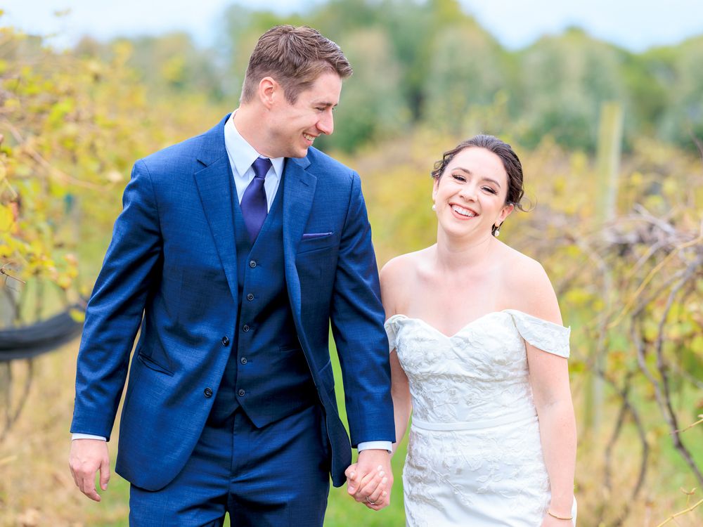 Couple Walking Through Vineyard During Wedding at Gervasi Vineyard in Canton, Ohio