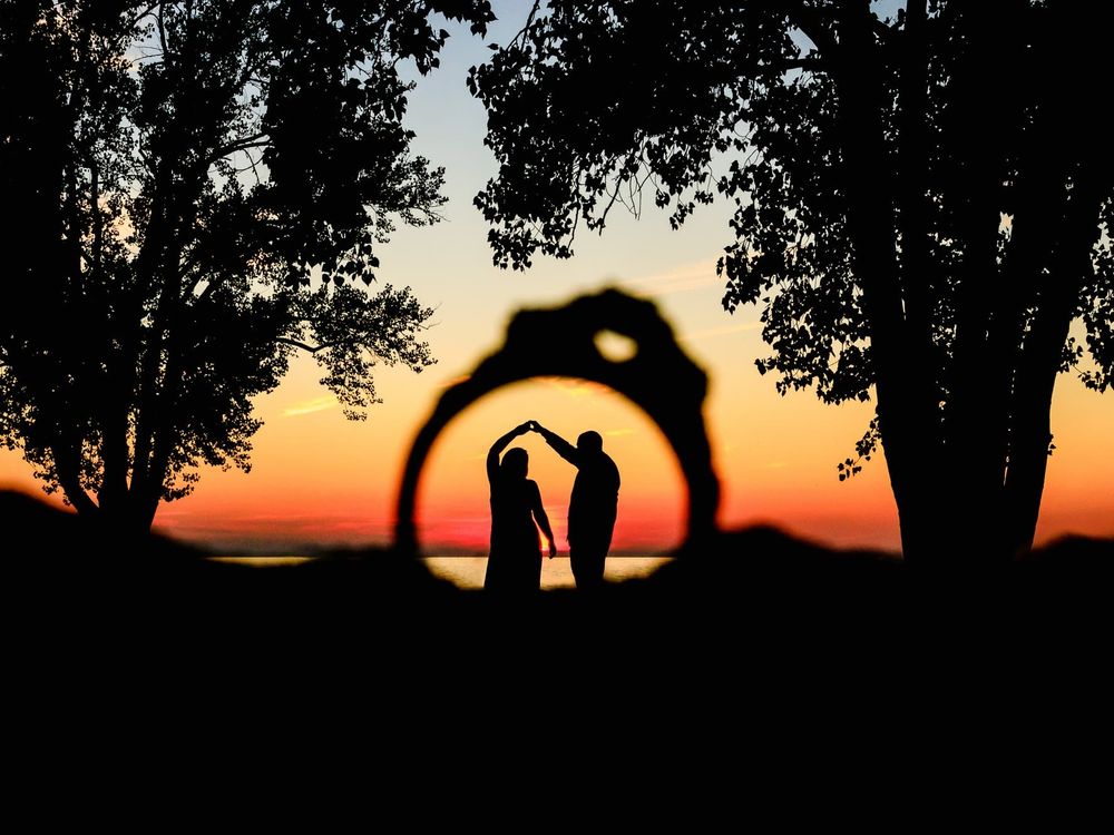 Couple During Engagement Photo Session at Edgewater Park Beach in Cleveland, Ohio