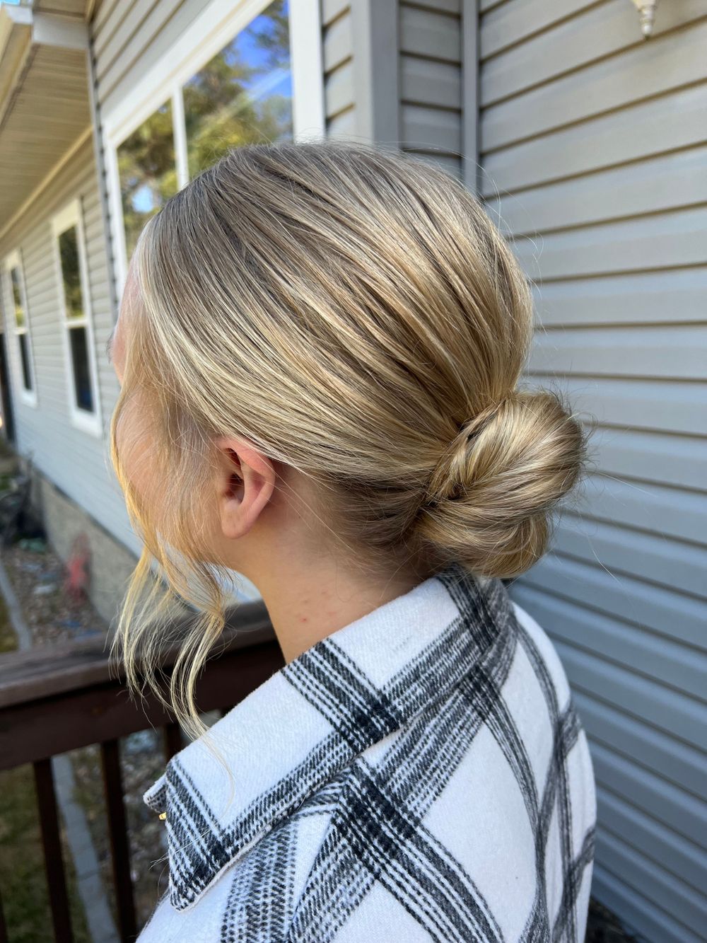 Hairstyling series showing a braided updo with a black and white plaid collar.